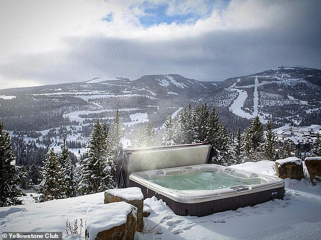 Yellowstone Club members can relax in the hot tub overlooking Montana's snow-capped mountains