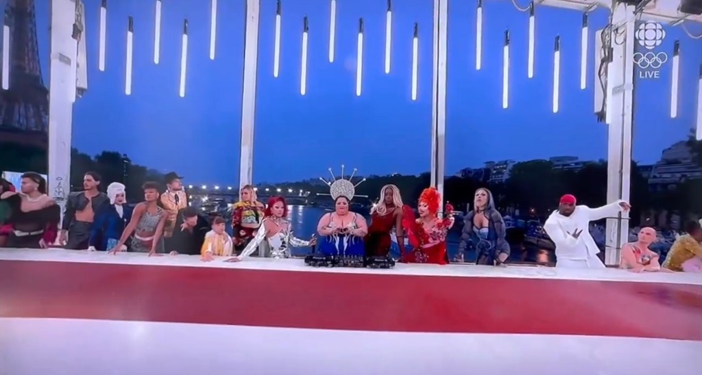 Men draw Jesus and disciples at the Last Supper during the Opening of the Olympic Games