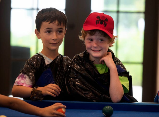 Ari Goodboy, 7, left, and William Maass, 7, wear a trash bag during the Funky Fashion show during Camp Palm Beach at the Mandel Recreation Center July 10, 2024. Children ages 5 to 8 created using trash bags and duct tape.  The last day of the camp is July 26, 2024.