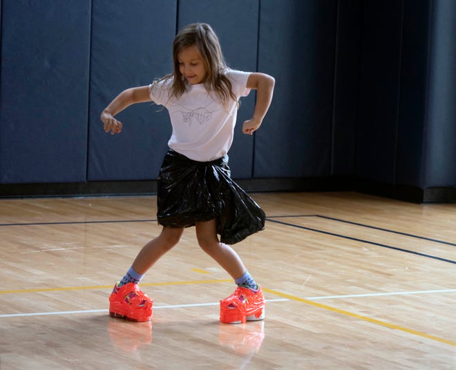 Wearing duct tape and a trash bag, Crawford Hely, 6, dances during the Funky Fashion show during Camp Palm Beach at the Mandel Recreation Center July 10, 2024. Children ages 5 to 8 created they use garbage bags and duct tape.  The last day of the camp is July 26, 2024.