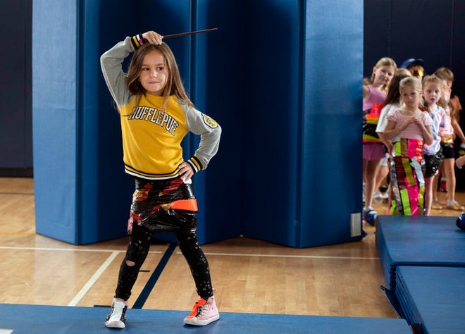 Johanna Mayes, 6, shows off her tapestry dress during the Funky Fashion show during Camp Palm Beach at the Mandel Recreation Center July 10, 2024. Children ages 5 to 8 created using trash bags and duct tape.  The last day of the camp is July 26, 2024.