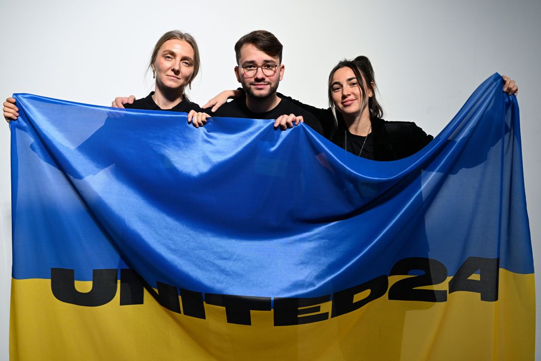 From left to right: Ksenia Schnaider, Ivan Frolov and Julie Paskal return to the stage before the Ukrainian Fashion Week show during London Fashion Week in February 2023.